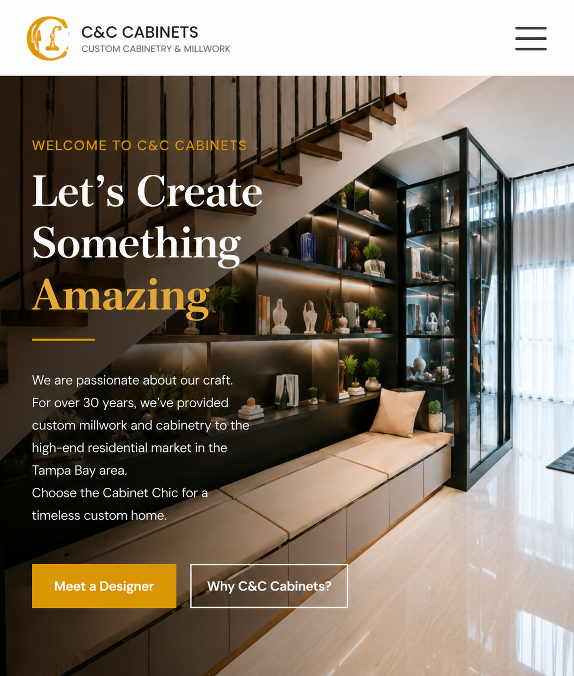 Modern showroom interior with dark open shelving and glass cabinets displaying decor, under a staircase; text overlay reads 'Let's Create Something Amazing' and 'Welcome to C&C Cabinets'.